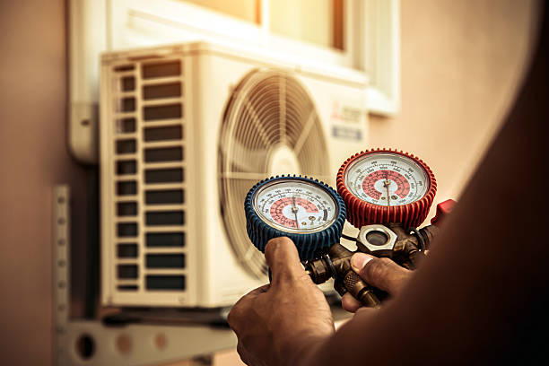 Professional Air Conditioning Service technician working in West Liberty, KY